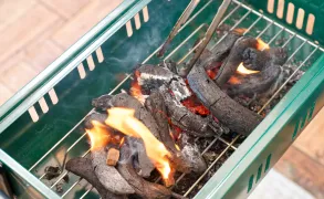 Burning charcoal in a grill